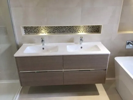 mordern double sink with dark wood drawers & inset shelve